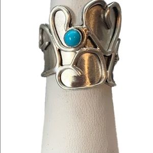 Adjustable sterling silver ring.